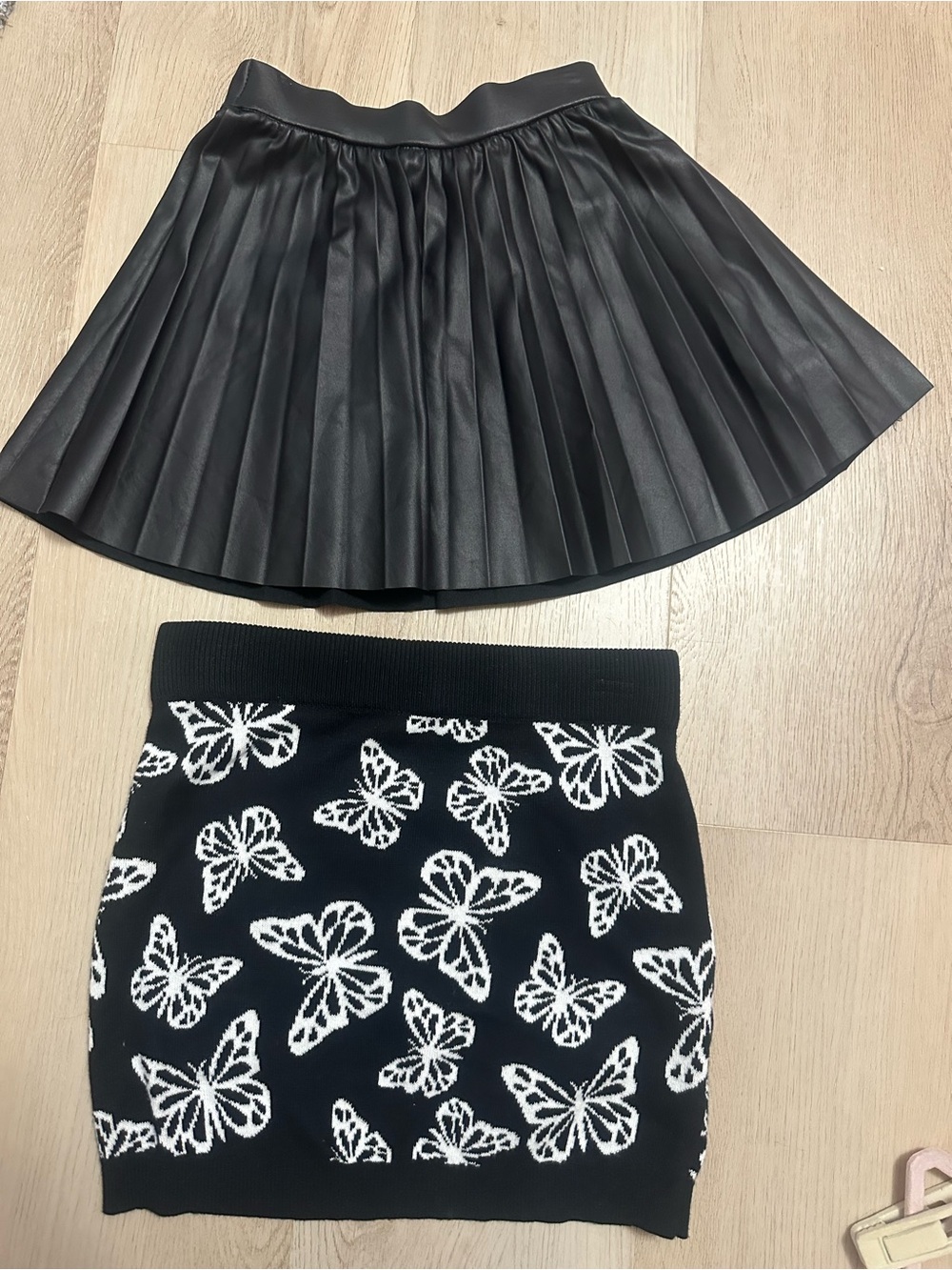 Set of 2 skirts: Pleated Faux Leather Mini Skirt & Black Butterfly Mini Skirt